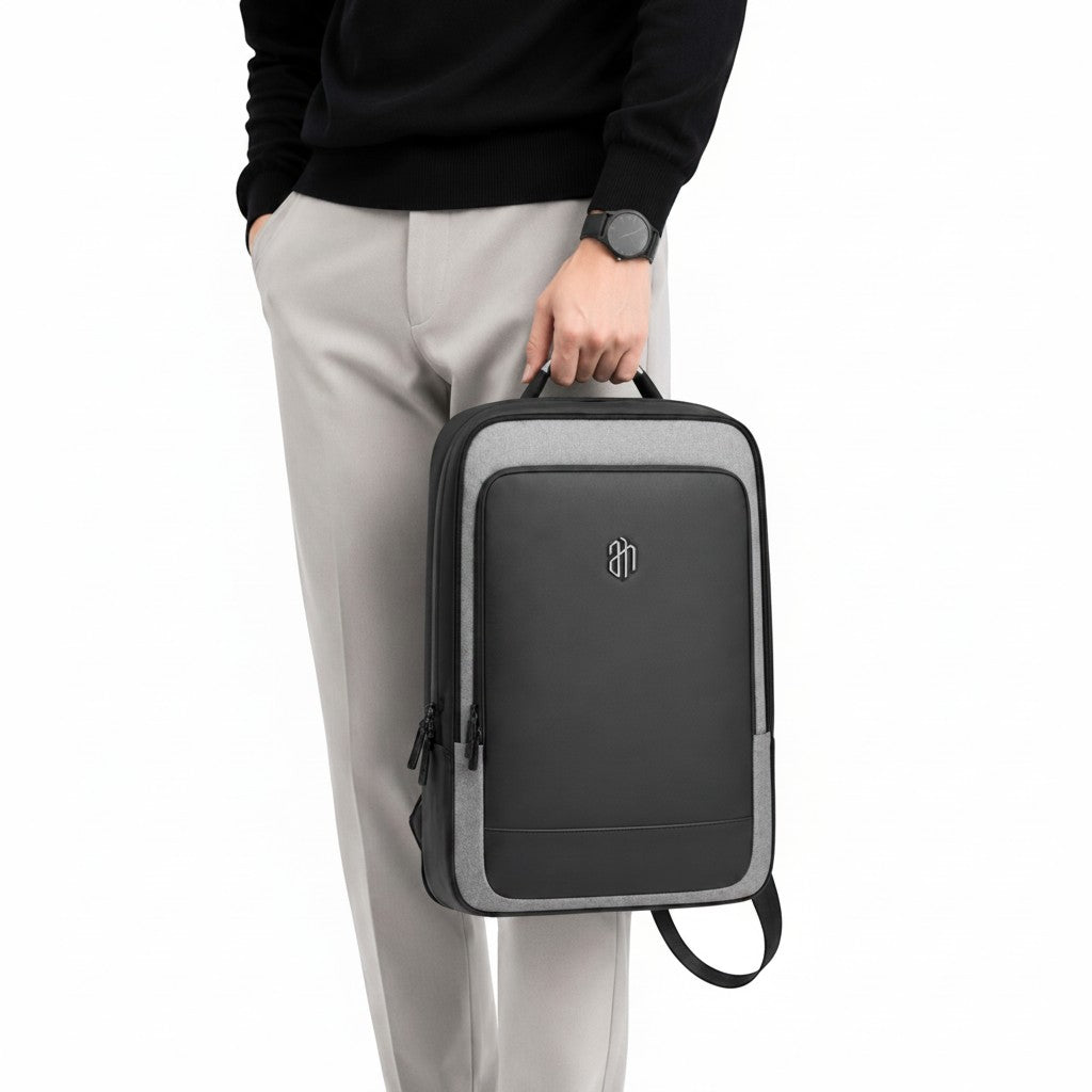 Sac à dos business ARCTIC HUNTER noir et gris porté à la main, design élégant et moderne par Univers Sac
