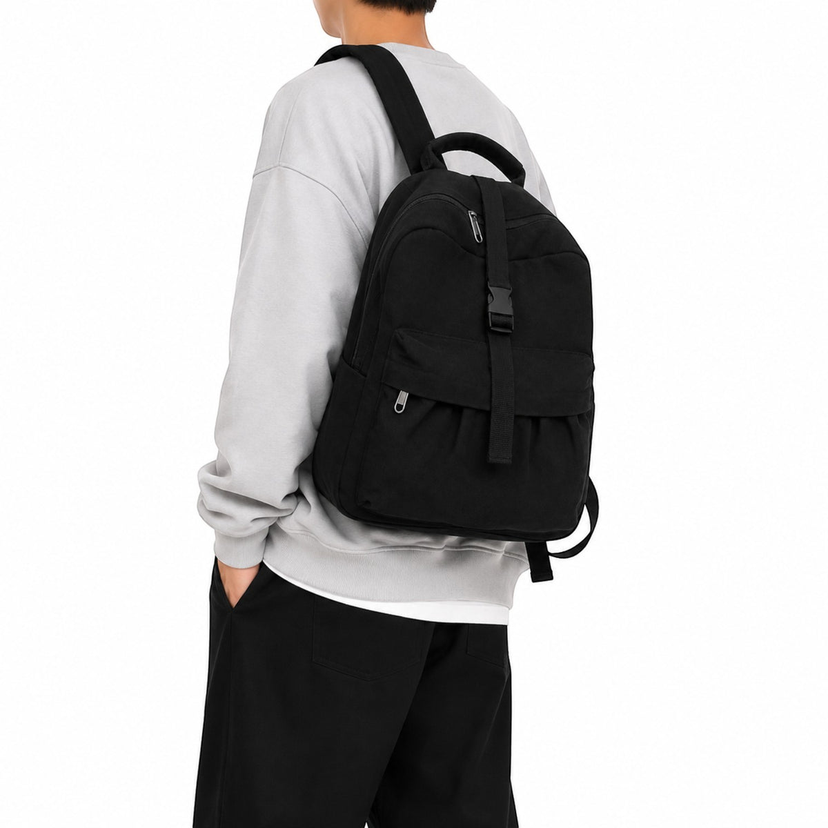Petit sac à dos décontracté Univers Sac en toile noire avec fermeture éclair et sangle réglable porté par un mannequin
