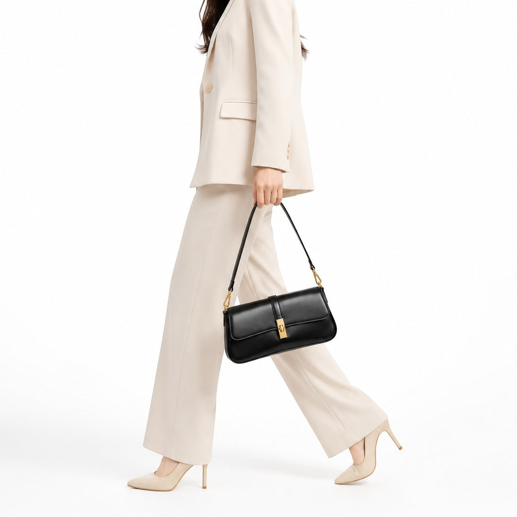 Univers Sac pochette bandoulière noire en cuir PU avec fermoir doré, idéale pour femme.