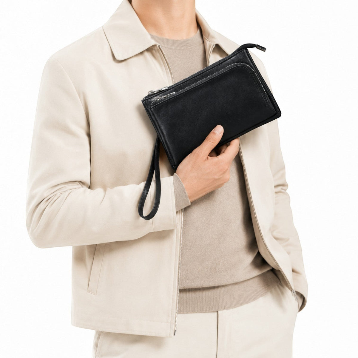 Pochette homme en cuir véritable noir Univers Sac tenue à la main, style élégant et fonctionnel avec fermeture éclair.
