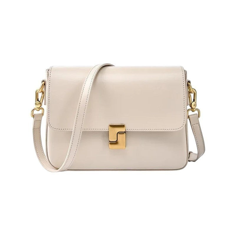 Sac bandoulière Univers Sac en cuir véritable blanc cassé avec fermoir doré et bandoulière réglable.