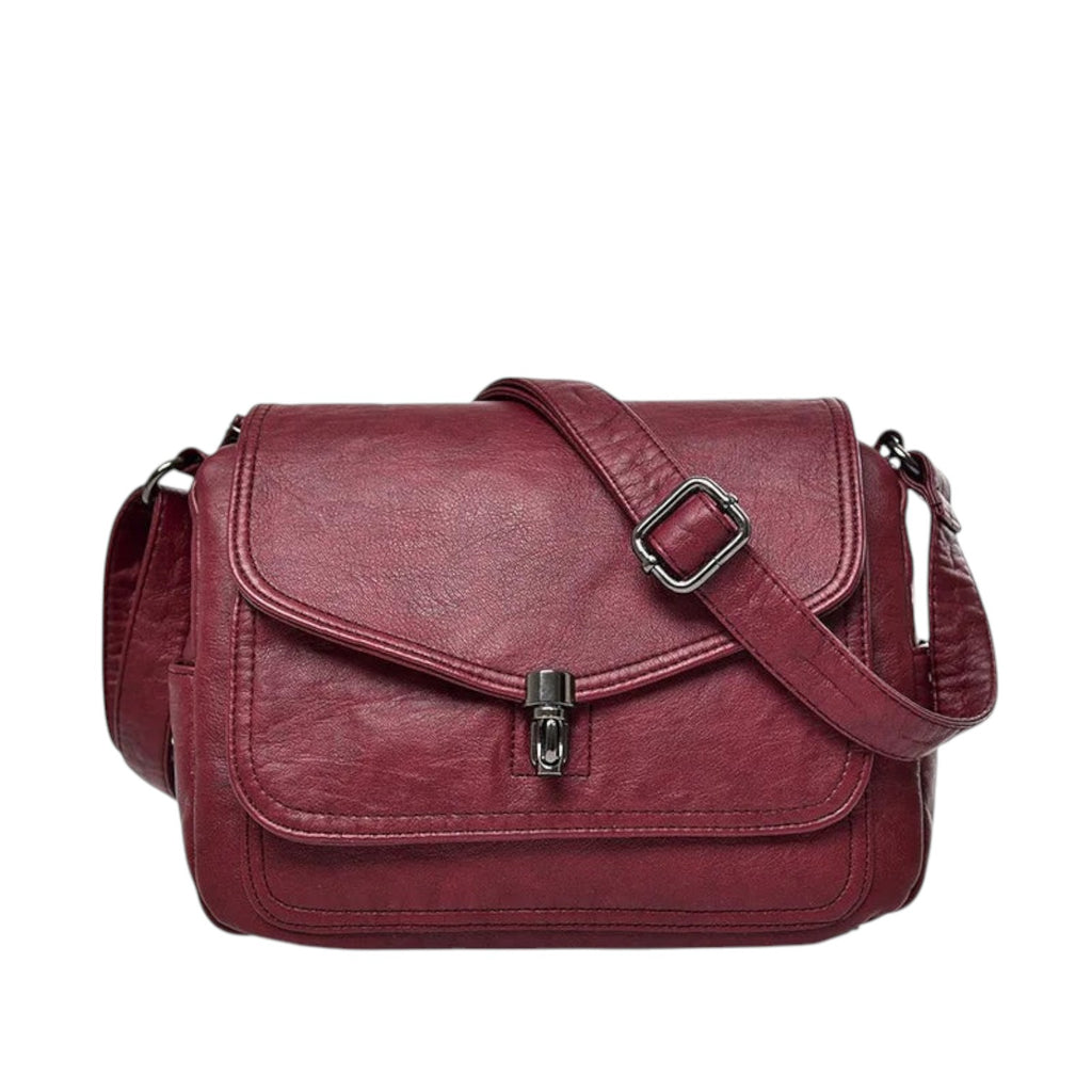 Sac bandoulière vintage en cuir PU bordeaux avec fermeture à fermoir métallique et bandoulière réglable. Univers Sac.
