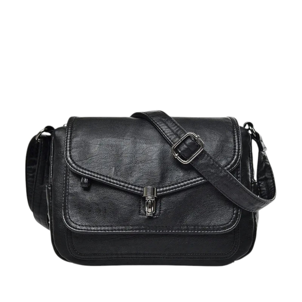 Sac bandoulière noir en PU souple, style vintage, avec fermoir métallique et bandoulière réglable. Idéal pour un usage quotidien.