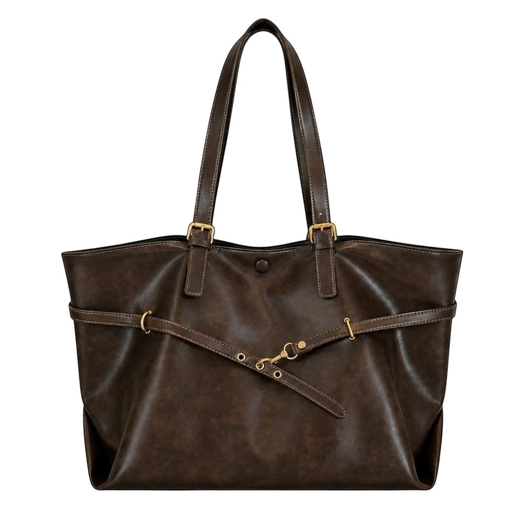 Sac bandoulière marron foncé en cuir PU souple, style rétro, avec détails de sangles et fermoir à pression, idéal pour un usage polyvalent.