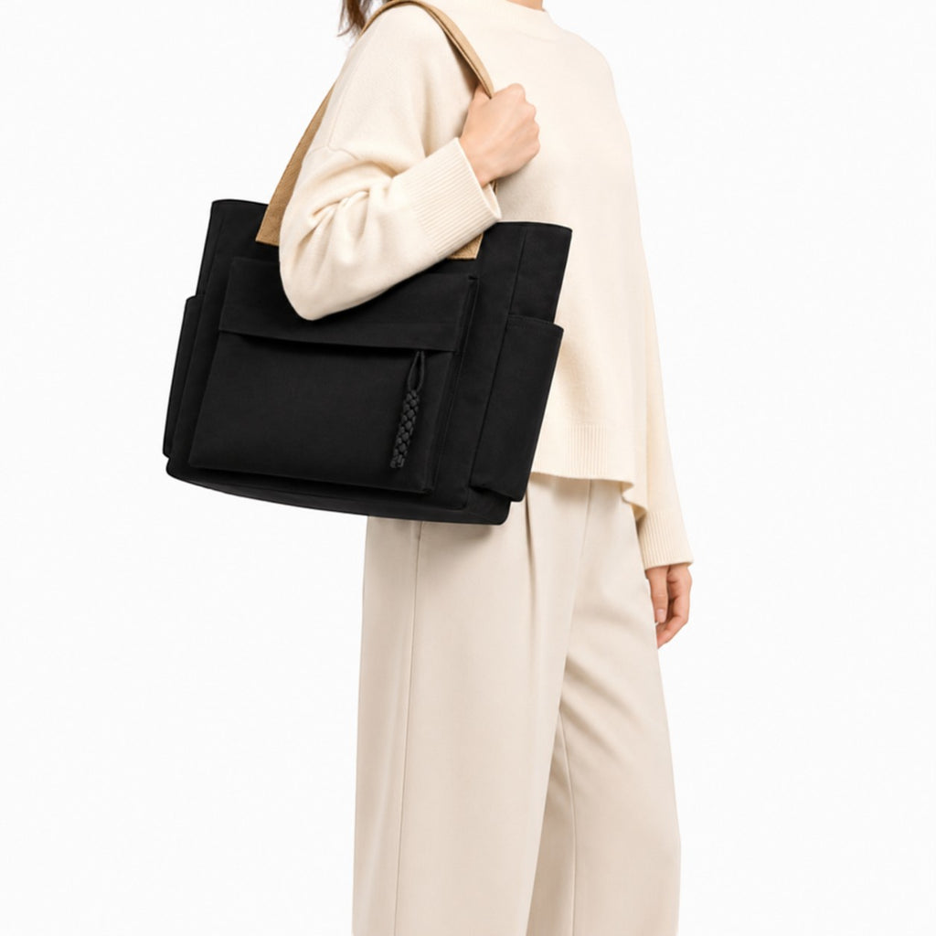 Sac bandoulière noir en toile Univers Sac avec poches extérieures et fermeture éclair, idéal pour un usage quotidien.