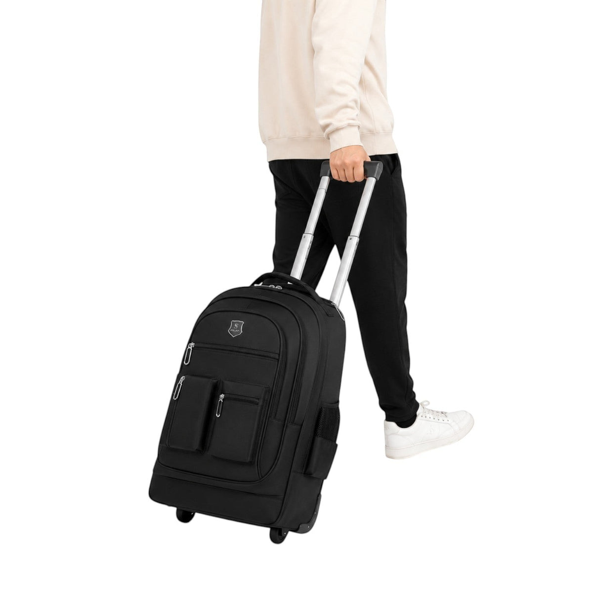 Homme utilisant un sac à dos de voyage noir Univers Sac à roulettes avec poignée télescopique sur fond blanc