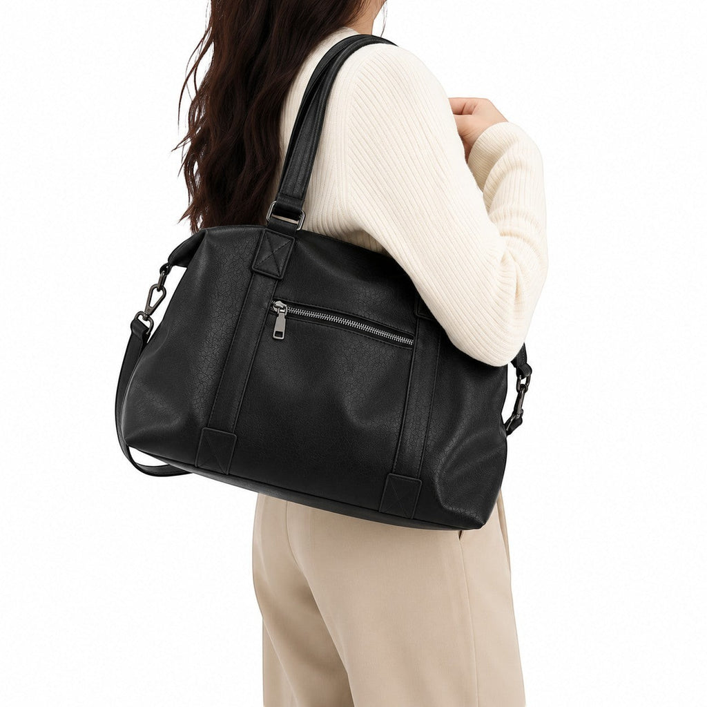 Sac fourre-tout noir en similicuir souple Univers Sac avec fermeture éclair et bandoulière réglable, idéal pour un usage quotidien.