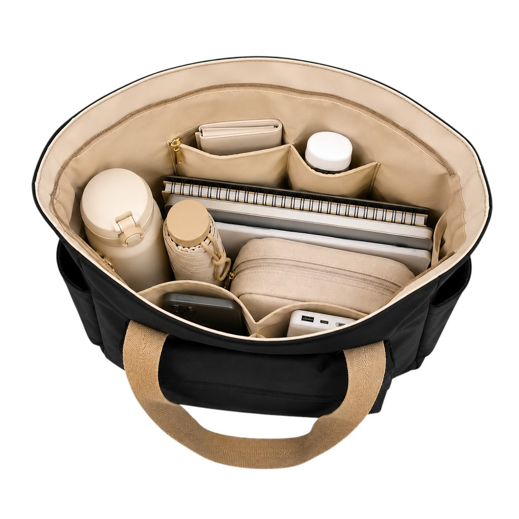 Sac fourre-tout noir en toile Univers Sac avec doublure beige, compartiments intérieurs pour organisation.