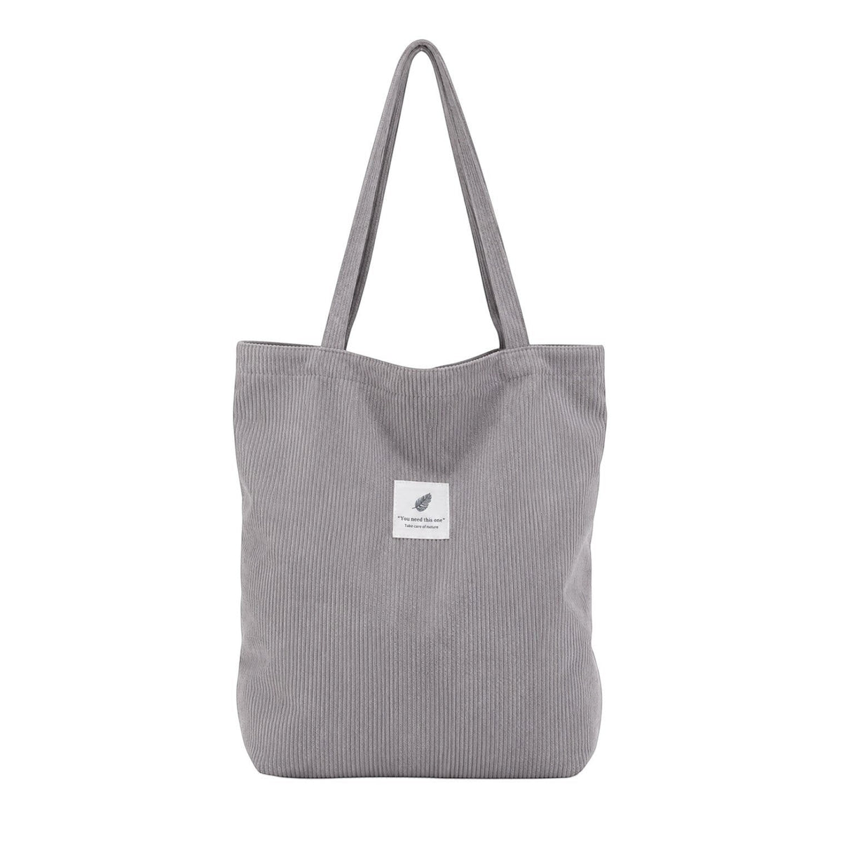 Sac fourre-tout gris en velours côtelé souple avec deux anses et une poche intérieure zippée. Idéal pour femmes.
