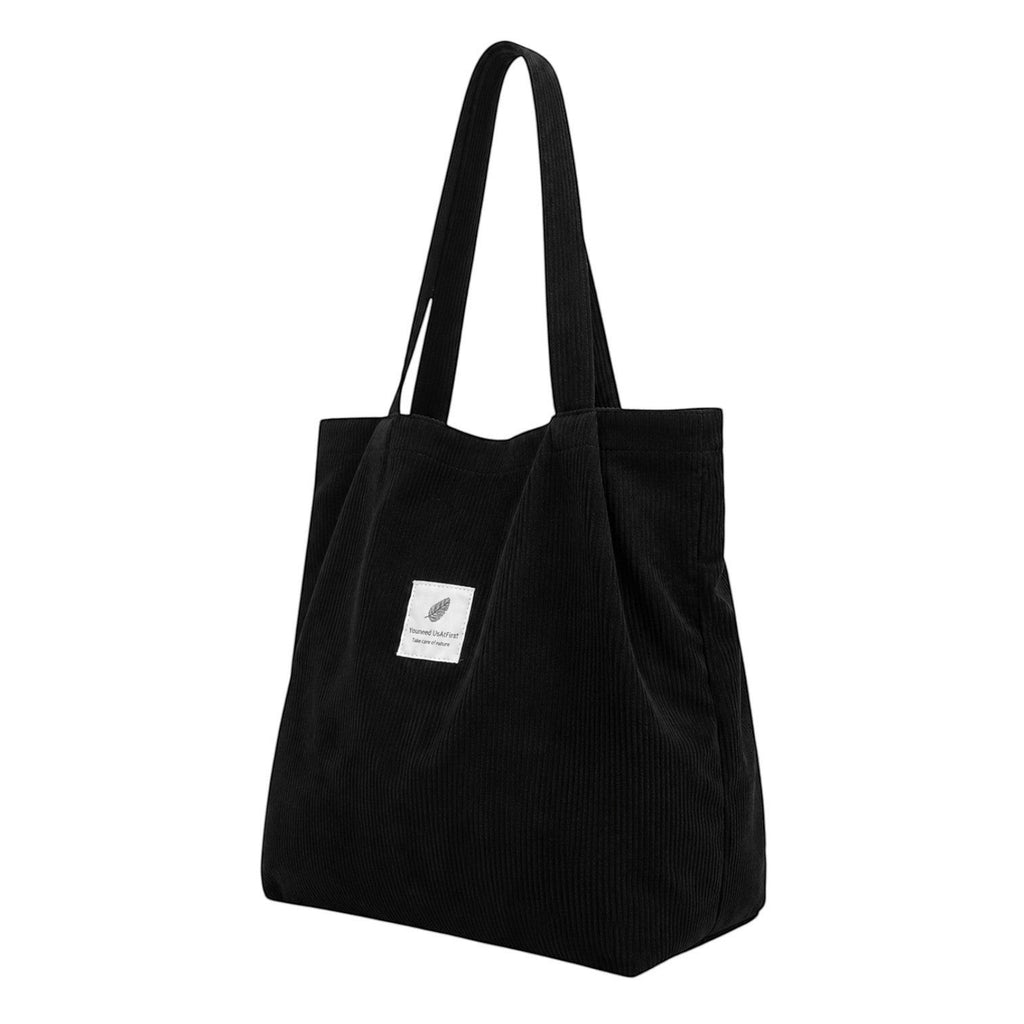 Sac fourre-tout noir en velours côtelé Univers Sac avec deux anses et une poche intérieure zippée.