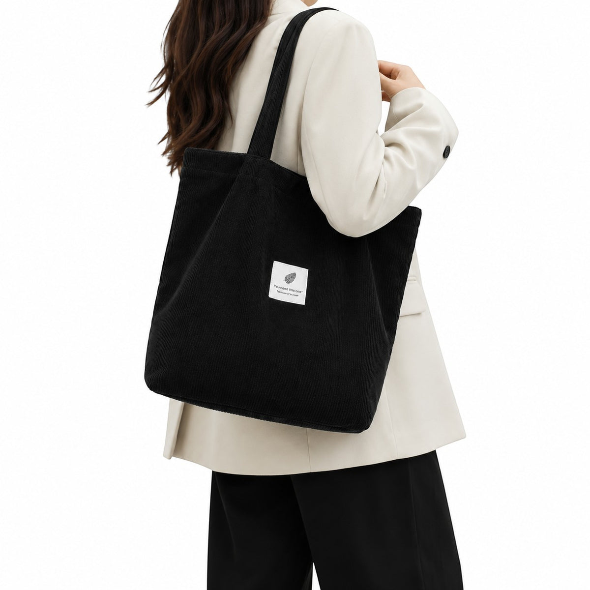 Univers Sac sac fourre-tout noir en velours côtelé avec deux anses, poche intérieure zippée et poche pour téléphone portable.