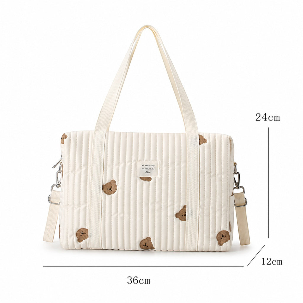 Sac à langer Univers Sac beige matelassé avec motif ours brodé, style coréen, fermeture éclair et bandoulière pratique.