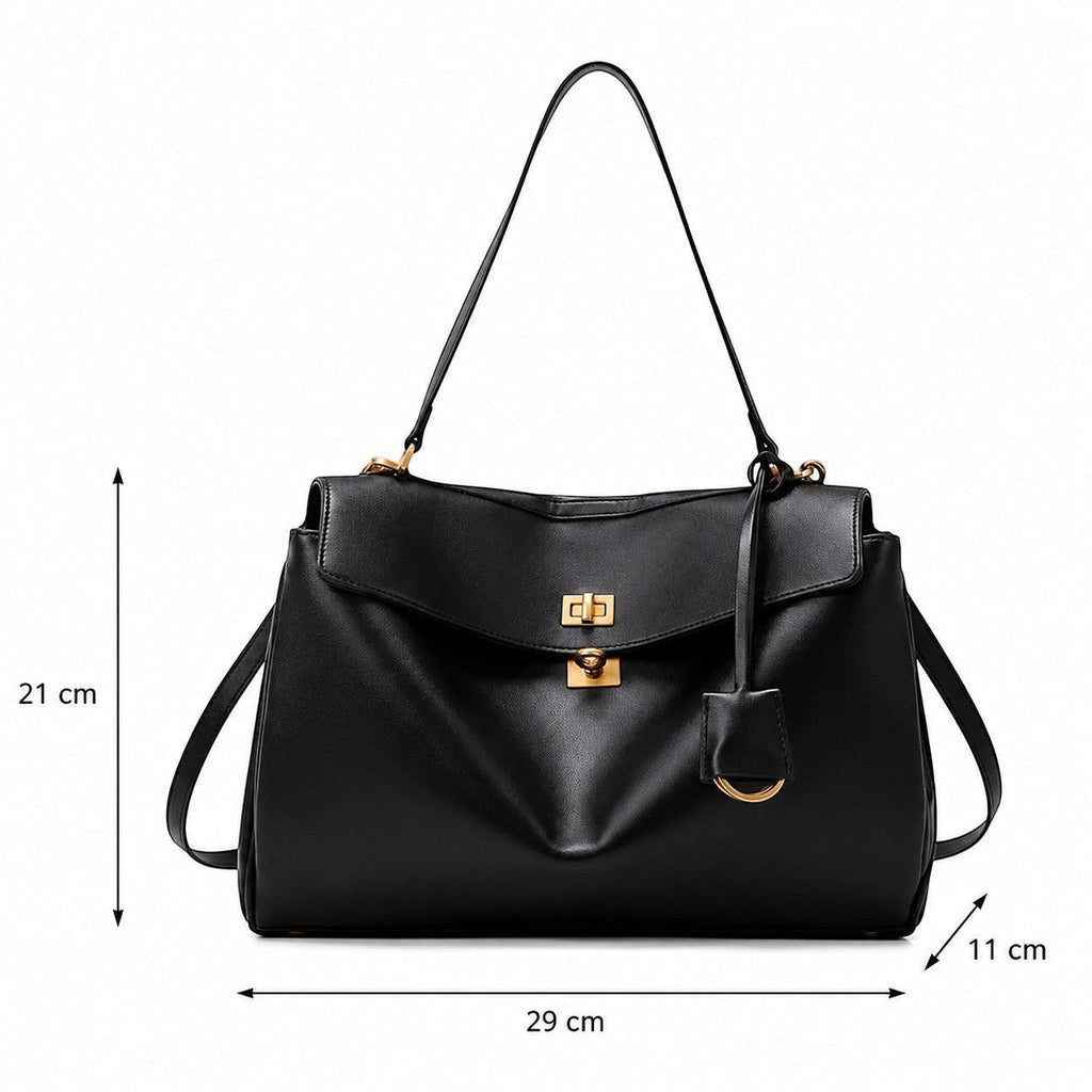 Sac à main noir en cuir de vache souple Univers Sac, forme satchel, avec fermoir doré et bandoulière réglable. Dimensions : 29x11x21 cm.