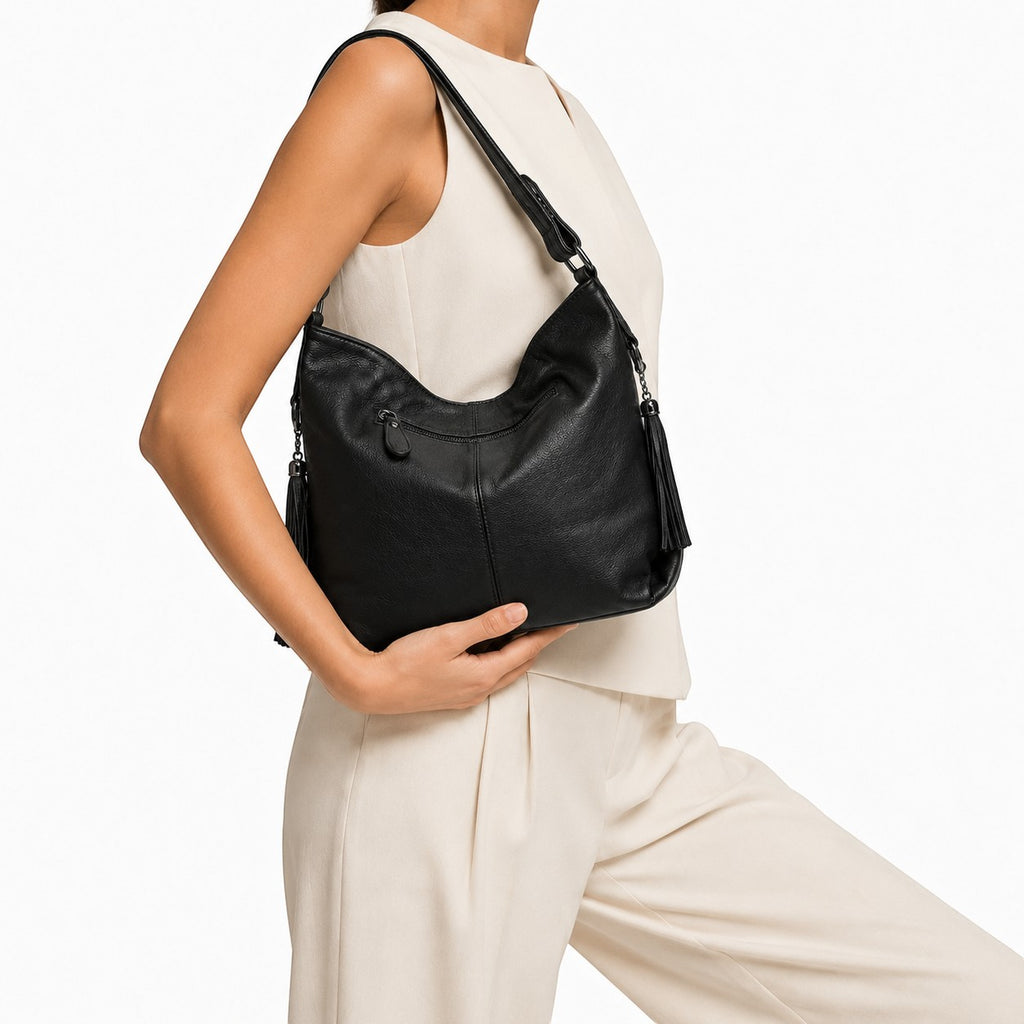 Sac à main noir en cuir véritable ZENCY pour femme, style hobo avec pompons décoratifs et fermeture éclair.