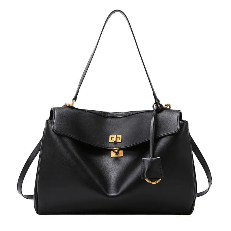 Sac à main noir en cuir de vache souple, de luxe, avec fermoir doré et bandoulière réglable. Univers Sac.