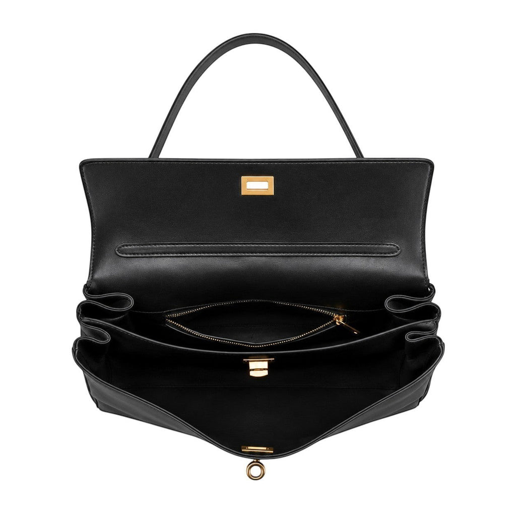 Sac à main noir en cuir de vache souple, modèle satchel avec une poche intérieure zippée et une fermeture dorée. Univers Sac.