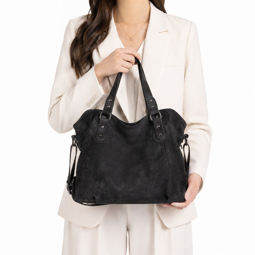 Sac à main noir en cuir PU souple, style vintage, avec détails rivets et pompons, par Univers Sac.