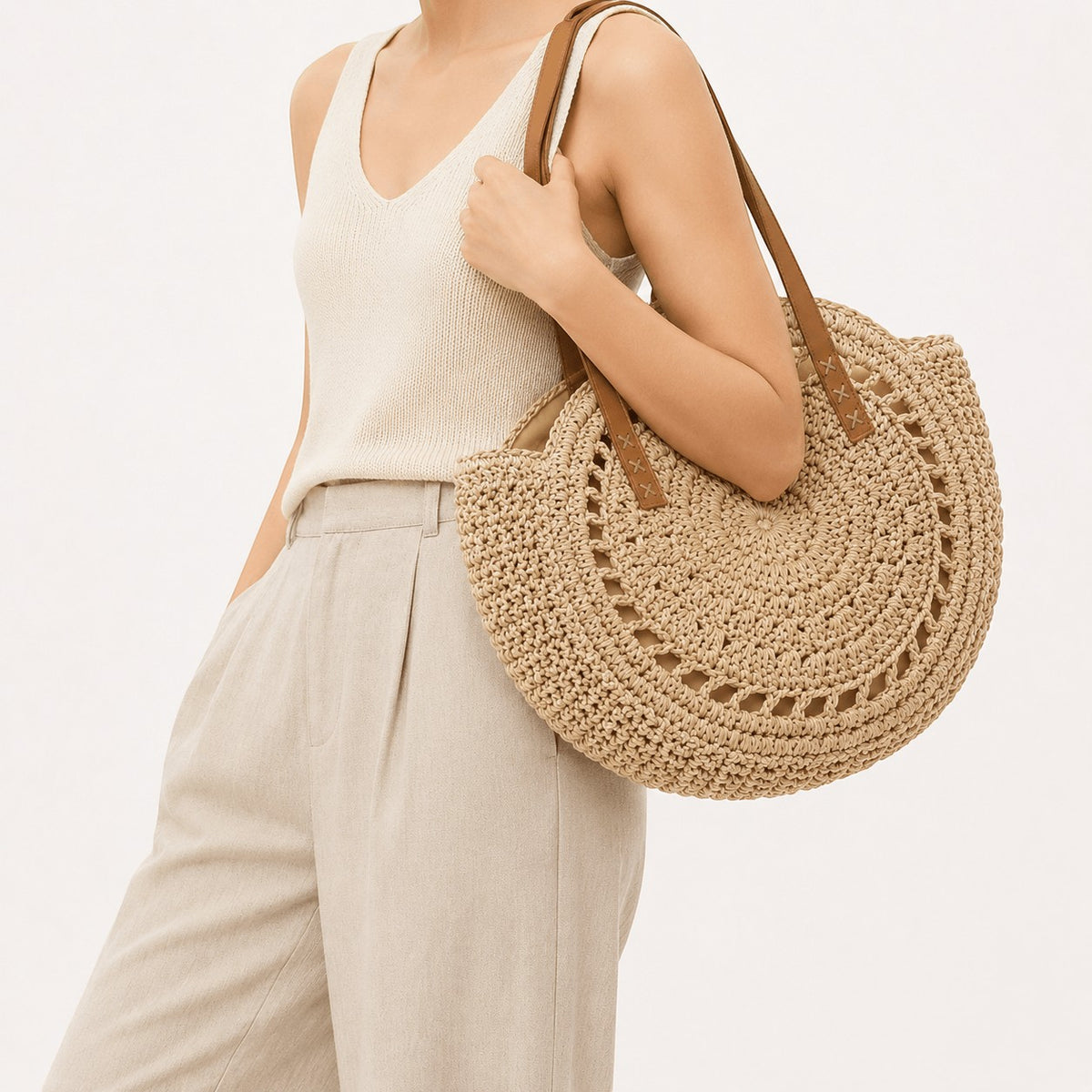 Sac à main rond en paille beige Yogodlns avec anses en cuir, décoration ajourée, idéal pour l'été.
